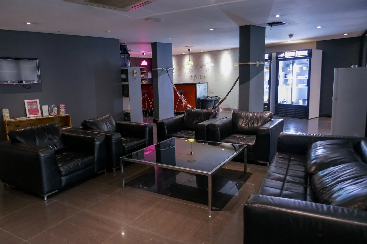 Shared lounge with seating and a hammock at Once in Joburg